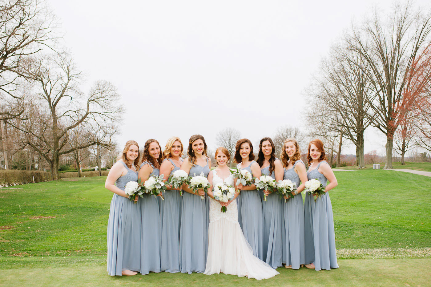 bride and bridesmaid portraits on golf course