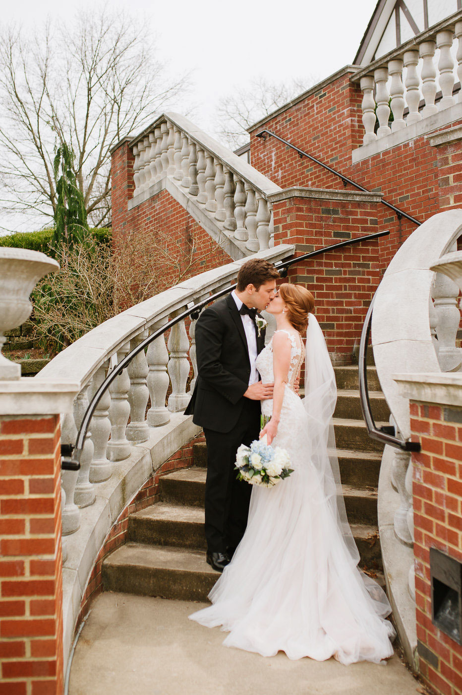 bride and groom portraits on staircase