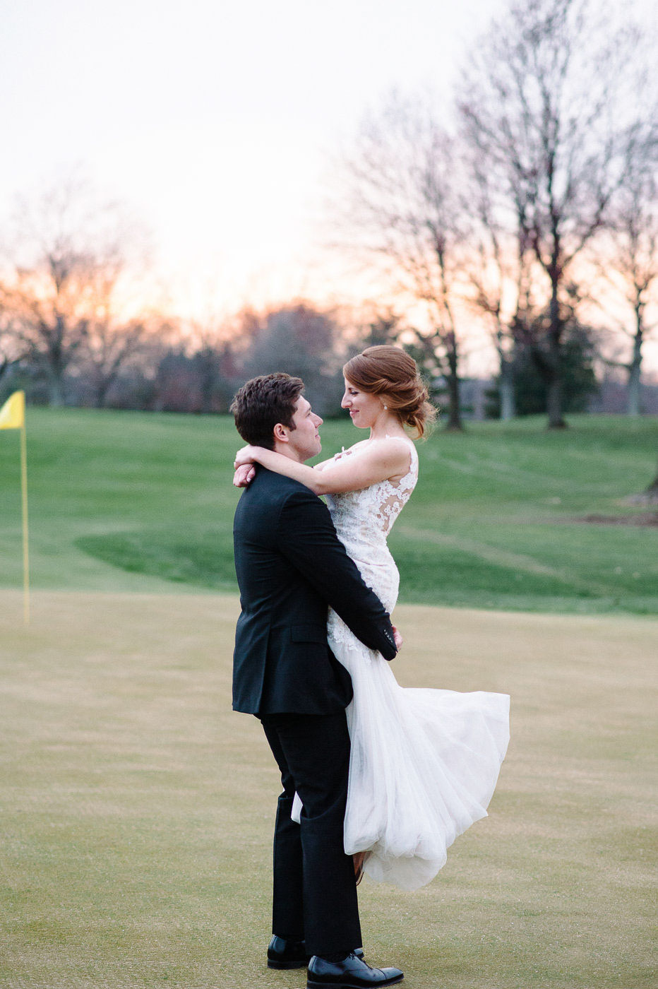 bride and groom sunset portraits on golf course