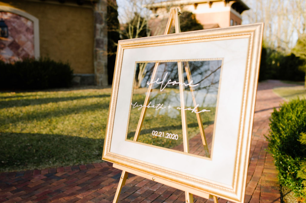 gold glass frame welcome wedding sign at gervasi vineyard